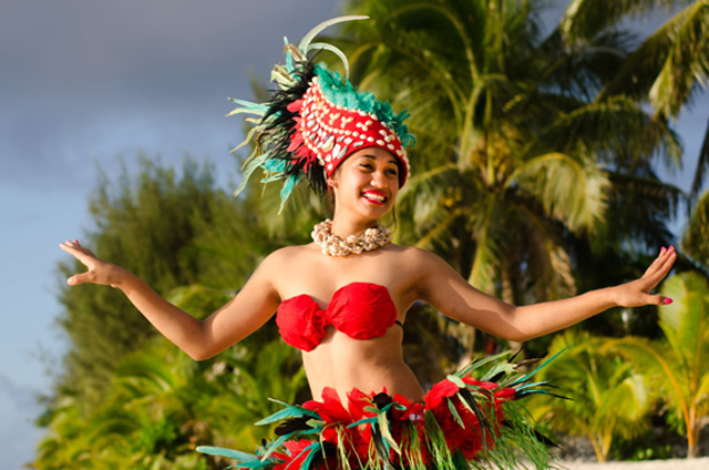 Happy young adult sexy Polynesian Pacific Island Tahitian female dancer