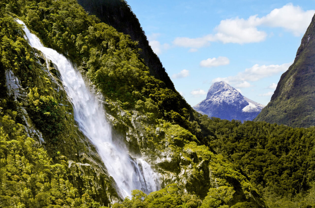 Spectacular waterfall in Milford Sound Fiordland New Zealand