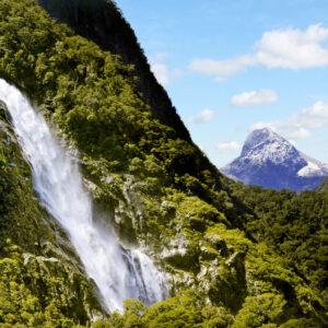 Spectacular waterfall in Milford Sound Fiordland New Zealand