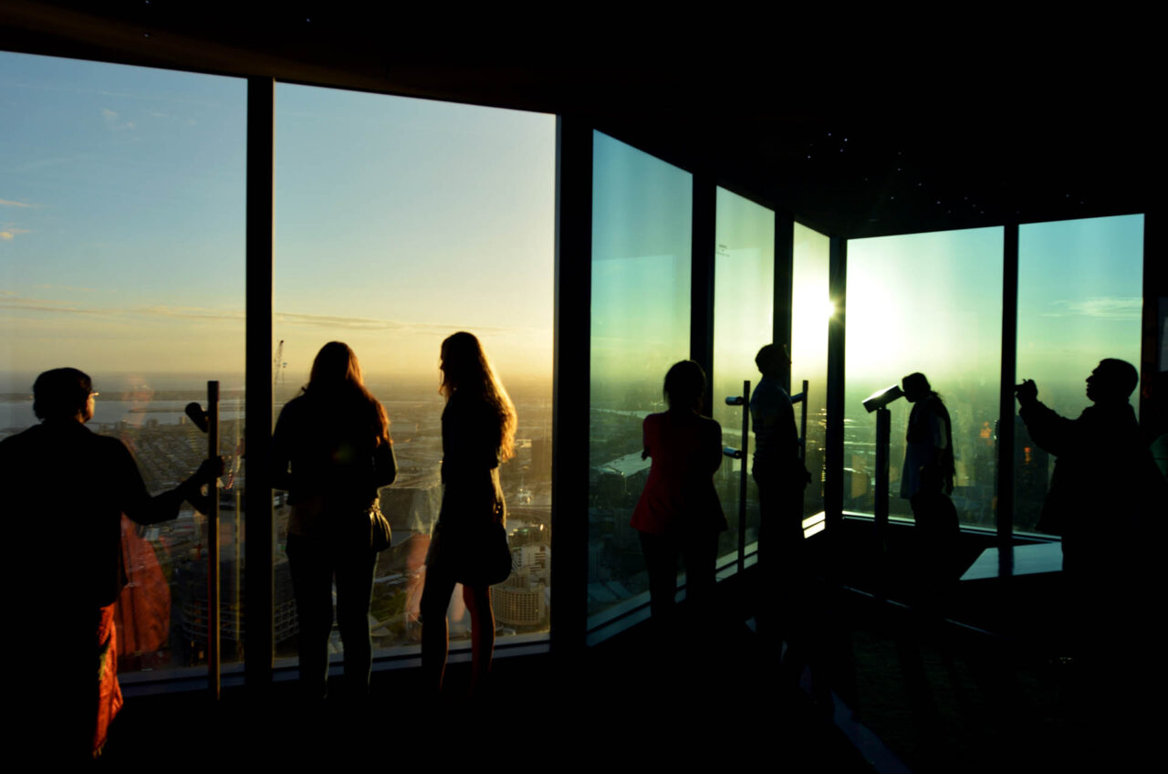 Visitors at Eureka Tower observation deck (Eureka Skydeck 88) looking at Melbourne capital city of Victoria, Australia