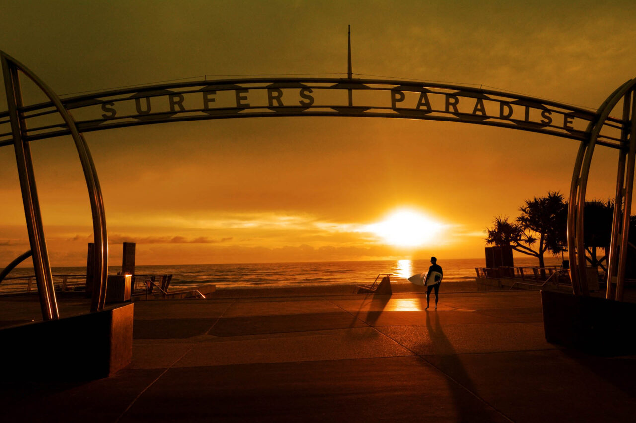 Surfer on the way to surf in Surfers Paradise Gold Coast Queensland ,Australia.