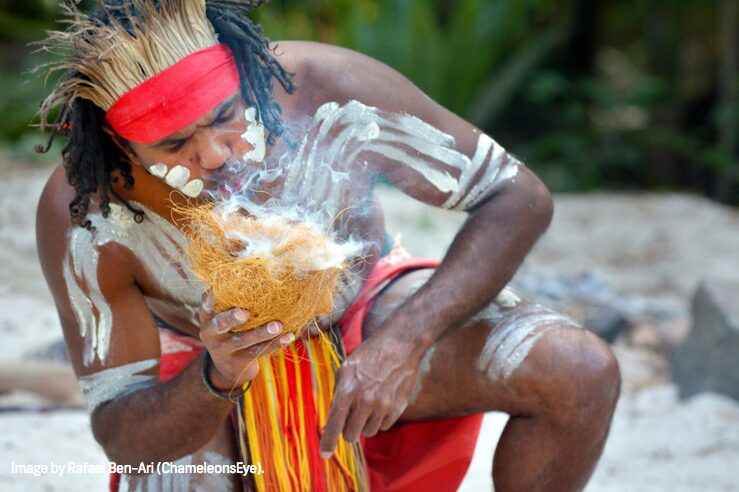 Portrait of Aboriginal warrior demonstrate fire making craft