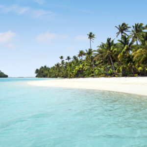 Landscape view of an empty tropical island beach (One Foot Island) in Aitutaki Lagoon, Cook Islands.