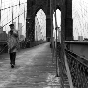 New Yorker crossing the East River on Brooklyn Bridge New York City NYC United States of America