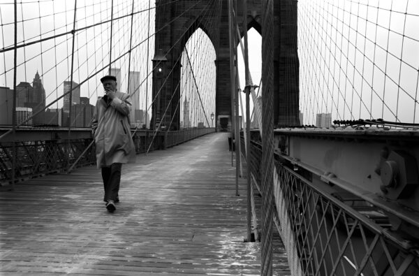 New Yorker crossing the East River on Brooklyn Bridge New York City NYC United States of America