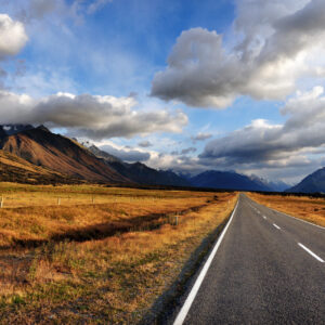 An open road leading to Mount Cook National Park in the South Island of New Zealand. End of the road, day, world, doomsday or dooms day concept.