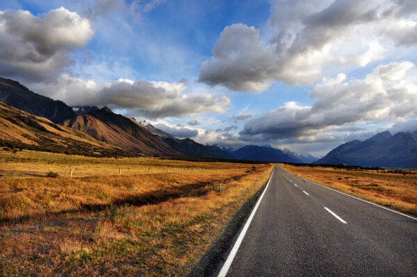 An open road leading to Mount Cook National Park in the South Island of New Zealand. End of the road, day, world, doomsday or dooms day concept.