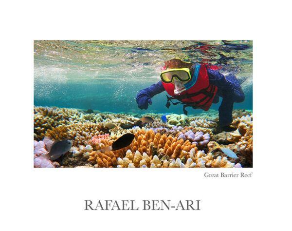 Australian person snorkeling scuba diving with life jacket vest and Lycra protection stinger suit at the Great Barrier Reef in the tropical far north of Queensland, Australia – Fine Arts Photography print for sale. Decoration poster of home or office wall taken by documentary travel photographer Rafael Ben Ari