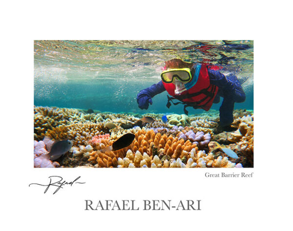 Australian person snorkeling scuba diving with life jacket vest and Lycra protection stinger suit at the Great Barrier Reef in the tropical far north of Queensland, Australia – Fine Arts Photography print for sale. Decoration poster of home or office wall taken by documentary travel photographer Rafael Ben Ari