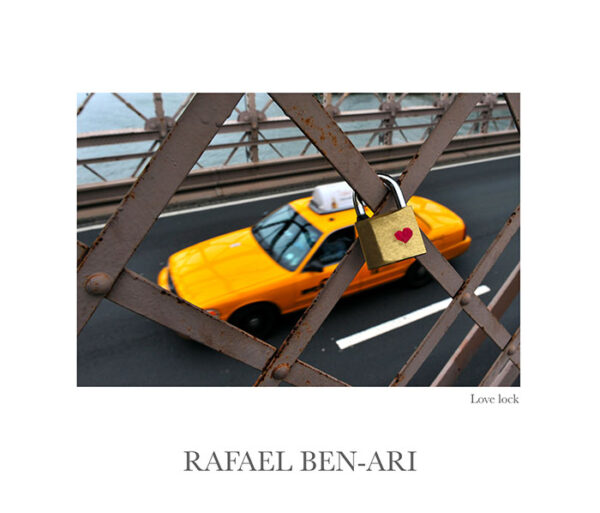 Love lock on Brooklyn Bridge while yellow medallion taxi cab drives on the under pass towards Manhattan New York City, USA – Fine art photography print for sale. Decoration poster for home or office wall taken by documentary travel photographer Rafael Ben Ari