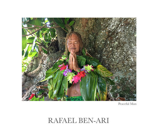 Peaceful Man – Pacific Islander praying for the environment under a rain forest tree in Rarotonga, Cook Islands – Fine art photography print for sale. Decoration poster for home or office wall taken by documentary travel photographer Rafael Ben Ari