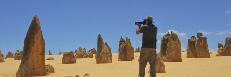 Australian travel photographer photographing The pinnacles desert landscape near Perth in Western Australia. The desert contain thousands of limestone formations called pinnacles.