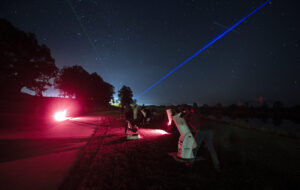 Australian people stargazing with astronomical telescope during winter solstice night