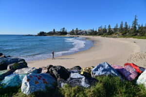 Aerial landscape view of The Breakwall at Port Macquarie, a town at the mouth of the Hastings River in New South Wales, Australia.