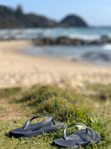 Pair of flip flops on a beach