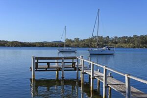 Sail boats mooring on the Camden Haven River Inlet in Dunbogan New South Wales, Australia.